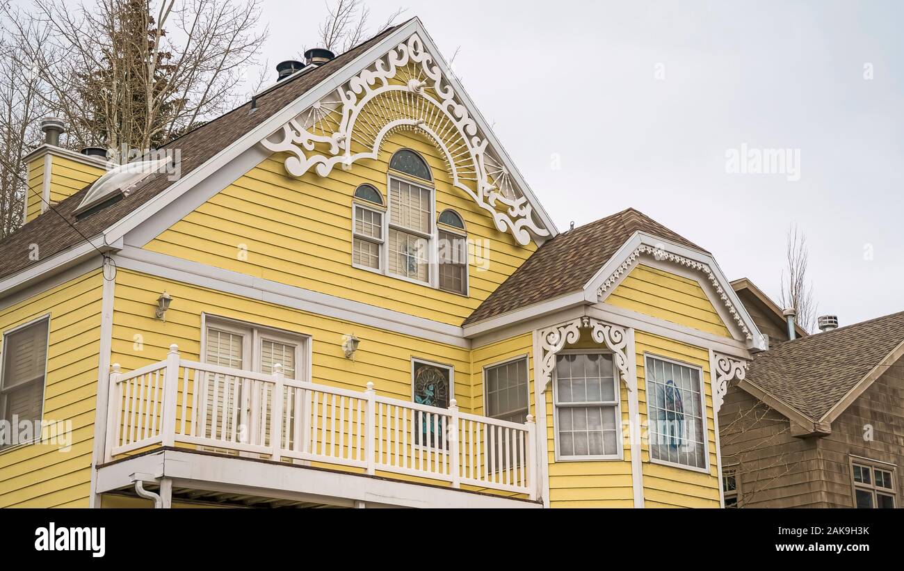 Pano Home in Park City with pastel yellow wall and balconies with white ...