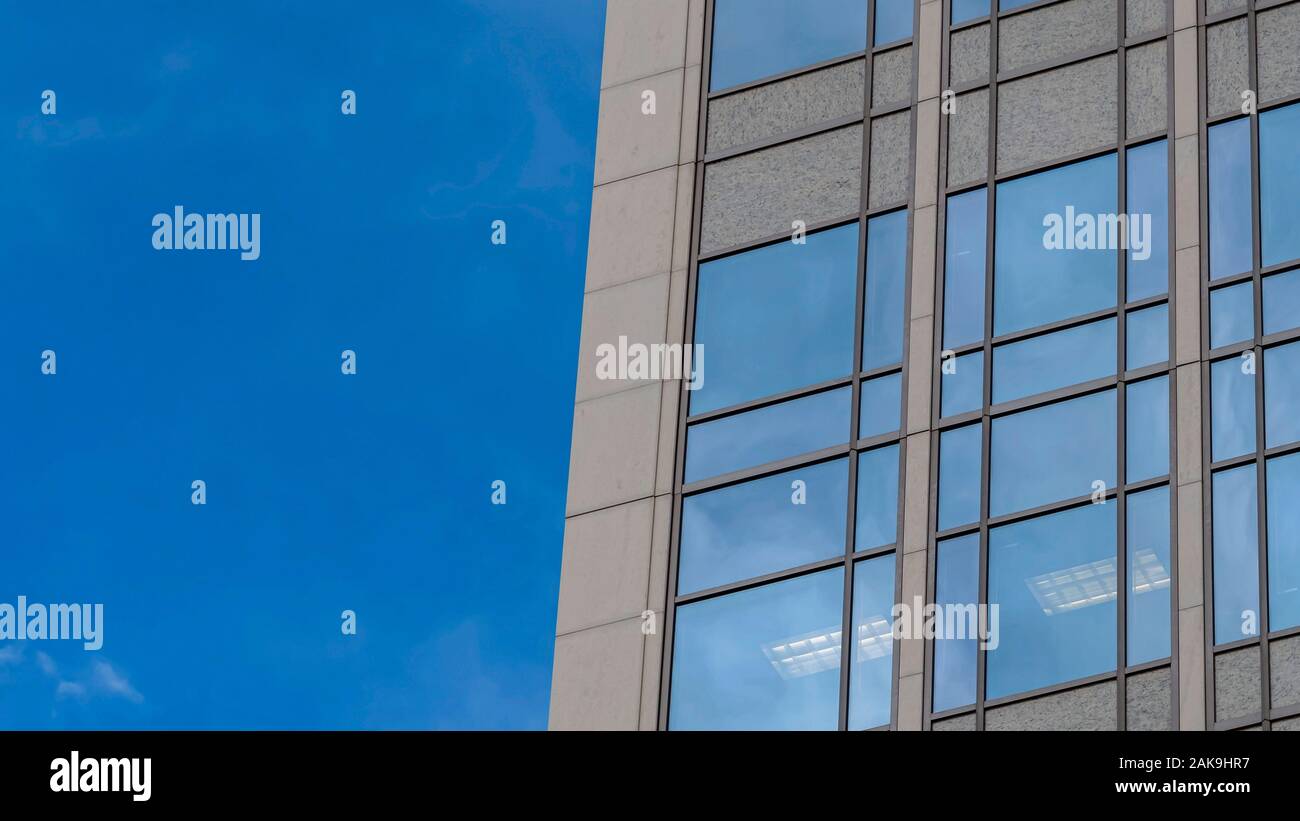 Pano frame Focus on a modern building exterior with glass windows ...