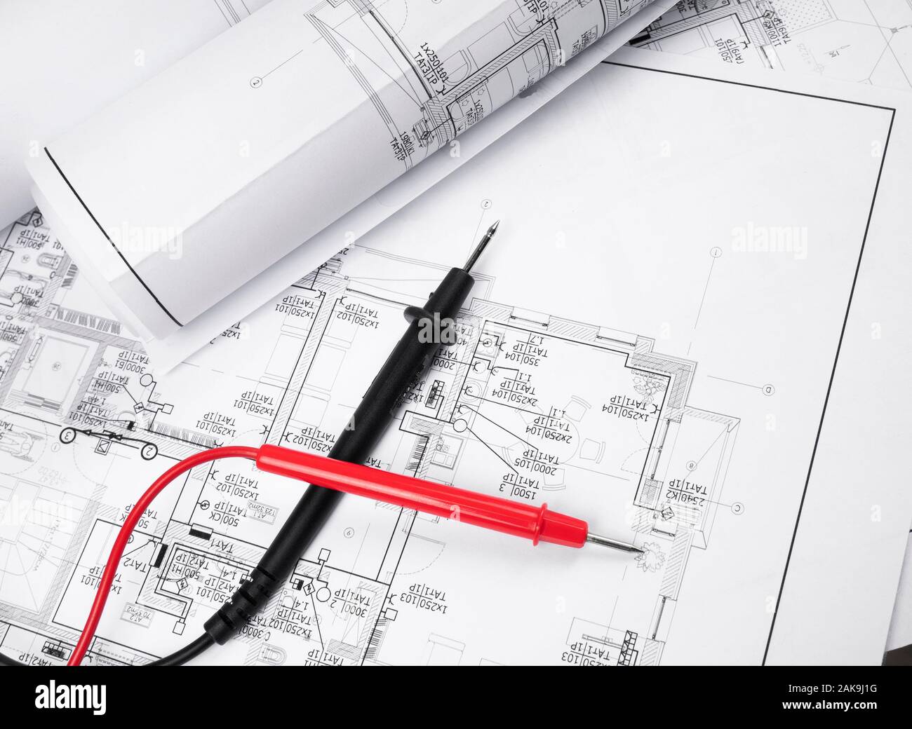High angle view on the plan of electrical installation and cables of multimeter Stock Photo