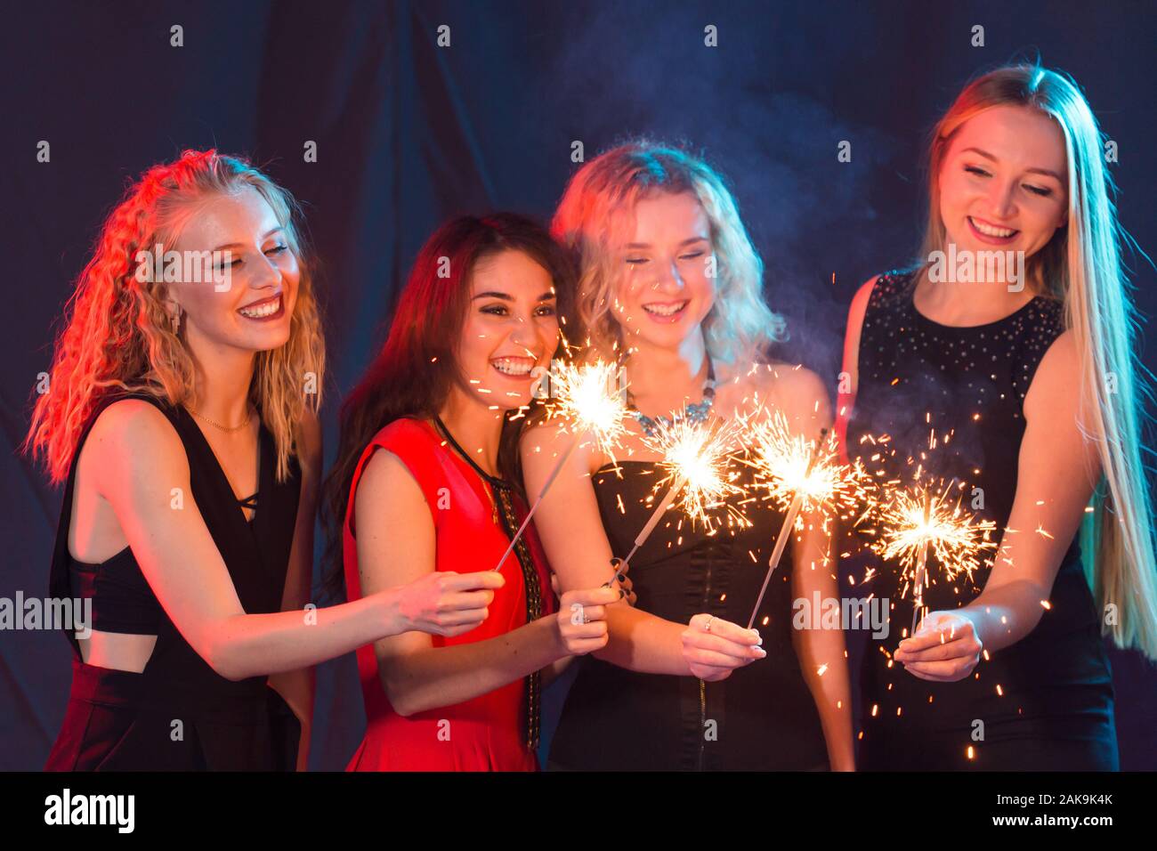 Birthday party, new year and holidays concept - Group of female friends