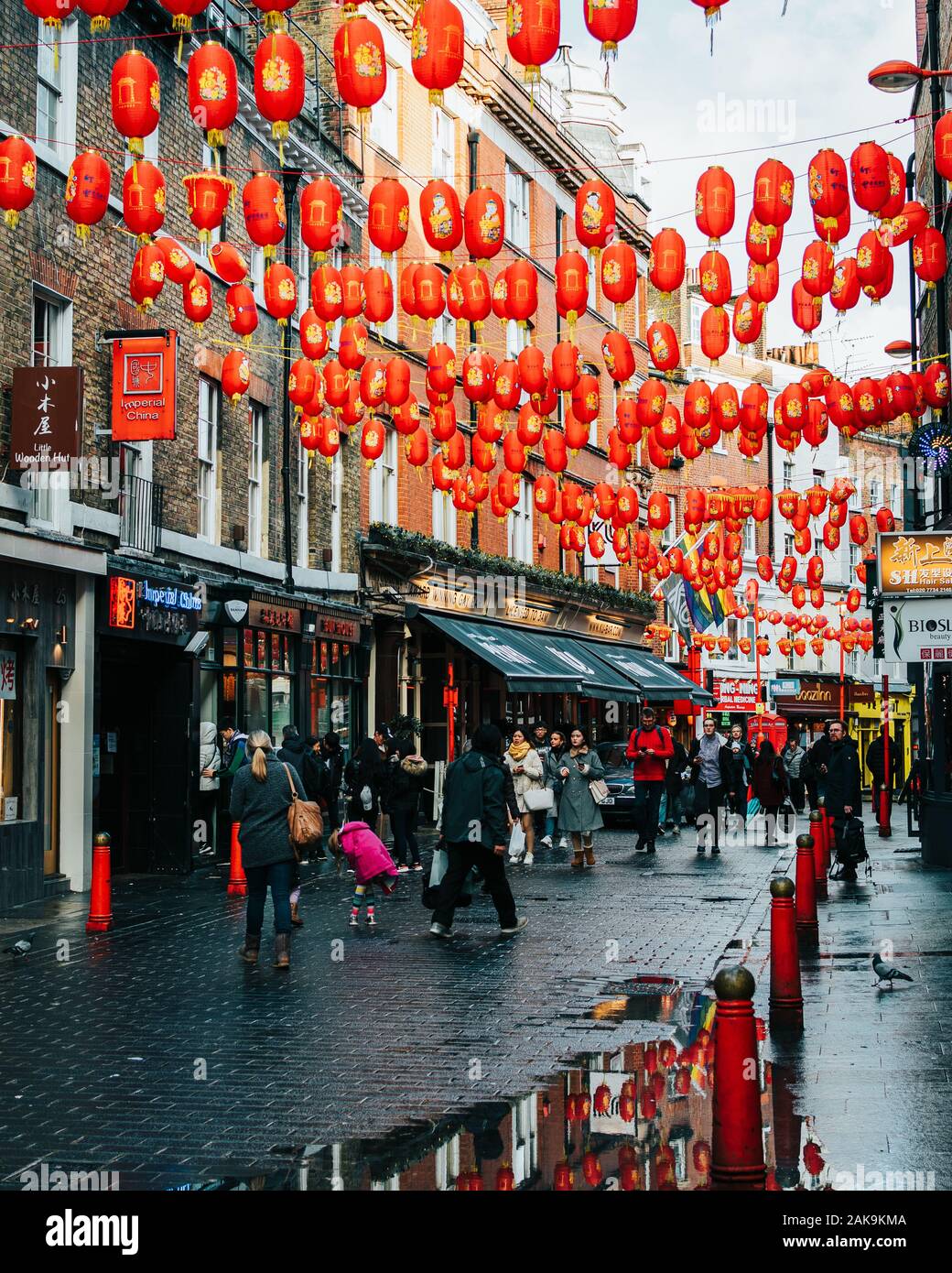 London, UK/Europe; 20/12/2019: Chinatown street full of chinese red lanterns, shops, restaurants and people walking and shopping. Soho district in Lon Stock Photo