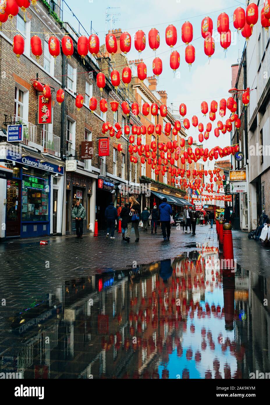London, UK/Europe; 20/12/2019: Chinatown street full of chinese red lanterns, shops, restaurants and people walking and shopping. Soho district in Lon Stock Photo