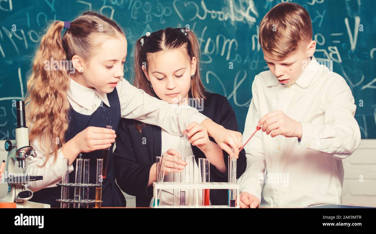 Little children. Science. biology experiments with microscope. Lab microscope and testing tubes. Chemistry science. Little kids scientist earning chemistry in school lab. Ready for final exam. Stock Photo