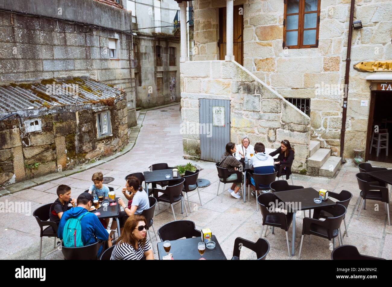 Cangas de Morrazo, Vigo, Spain : People relax at an outdoors cafe in the old town of Cangas. Stock Photo