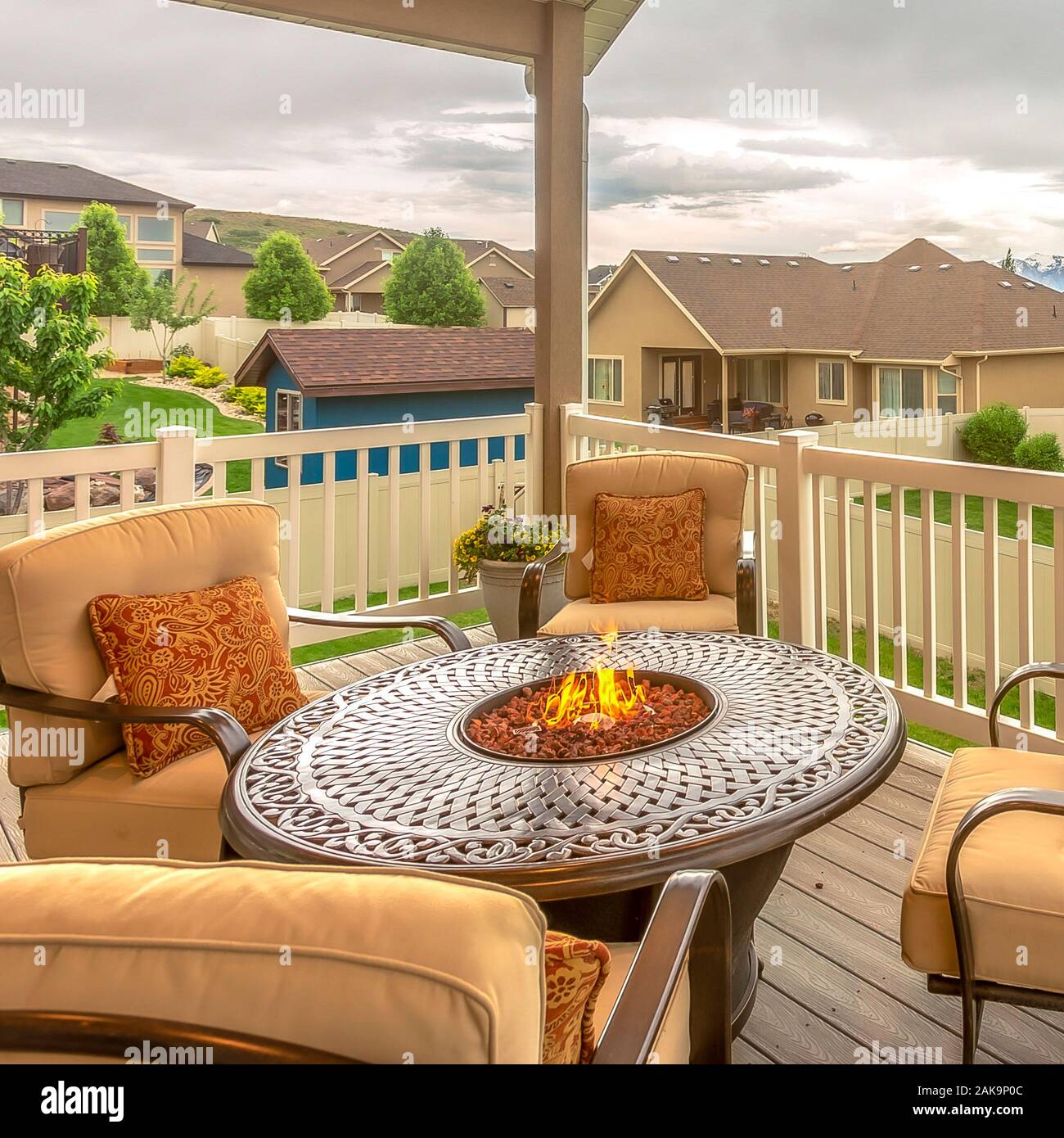 Square Chairs around table with fire pit at a residential balcony