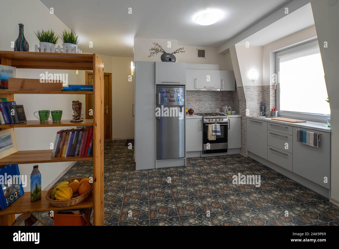 Modern stylish Scandinavian kitchen interior with kitchen accessories.  Bright white and grey kitchen with household items in studio apartment  Stock Photo - Alamy