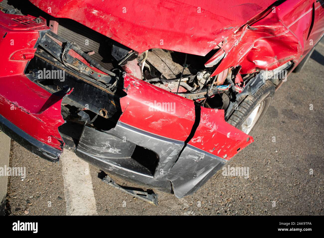 Front of red car get damaged by accident on the road Stock Photo Alamy
