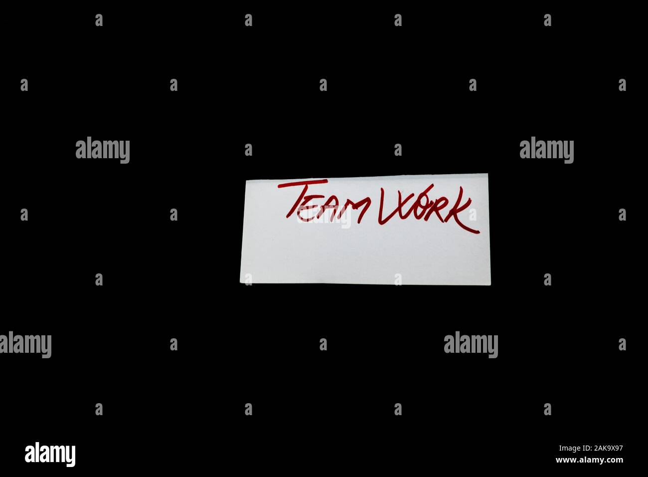 Text Teamwork on white label isolated on black background. Stock Photo