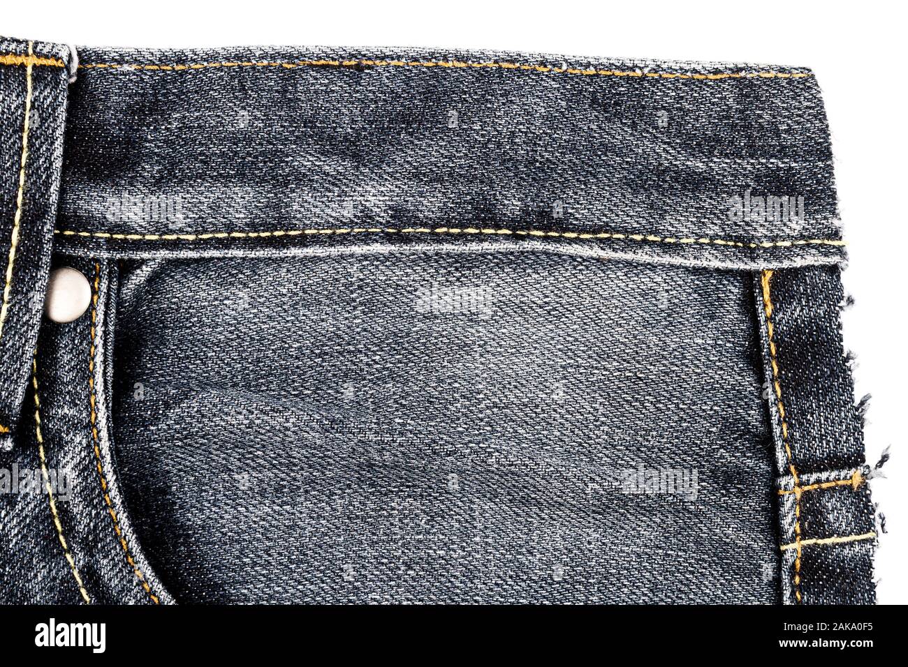Piece of black jeans fabric with a side 