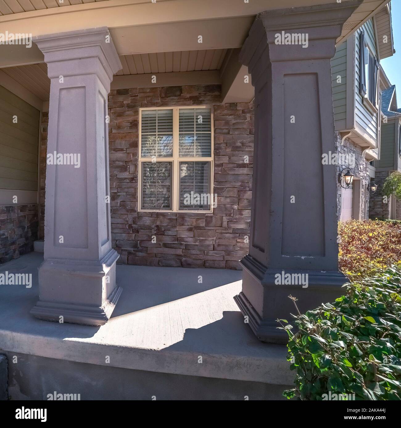 Square frame Decorative large pillars on an entrance porch Stock Photo