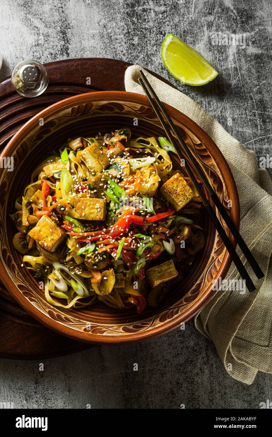 Asian vegan stir fry with tofu, rice noodles and vegetables, top view Stock Photo Alamy