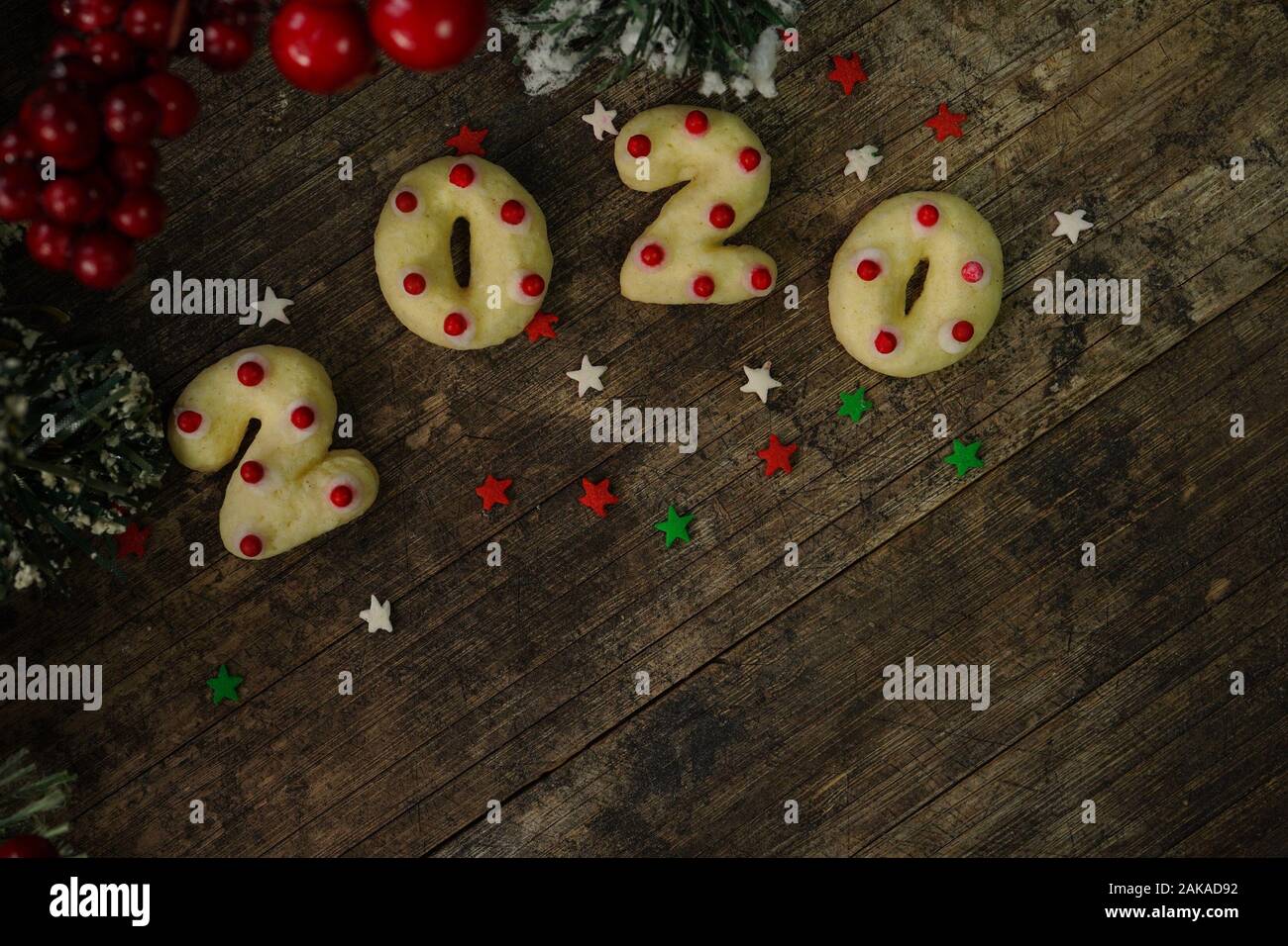 2020 shaped  new year sugar cookies on rustic wooden background Stock Photo