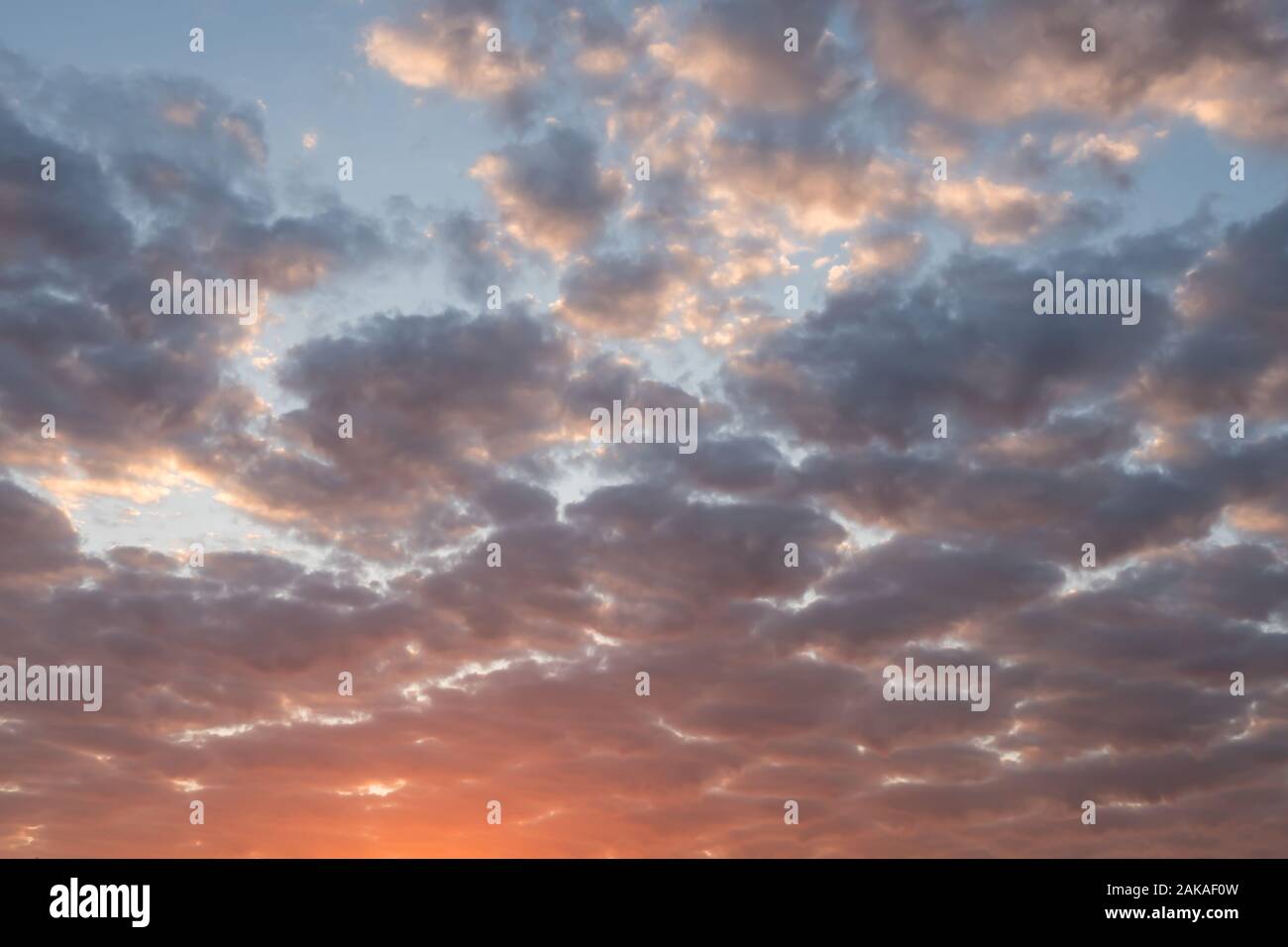 colorful sunset cloudy sky Stock Photo - Alamy