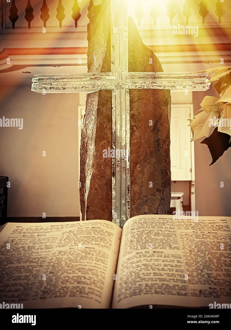 Crucifix and german holy bible in the light Stock Photo