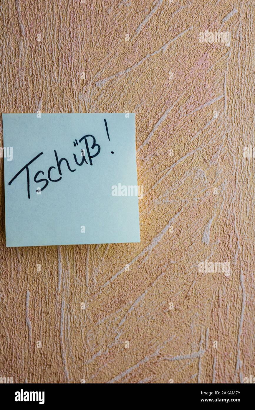 Text Tschuss (bye in English)on post it. Writing on colorful sticky note. Bucharest, Romania, 2020. Stock Photo