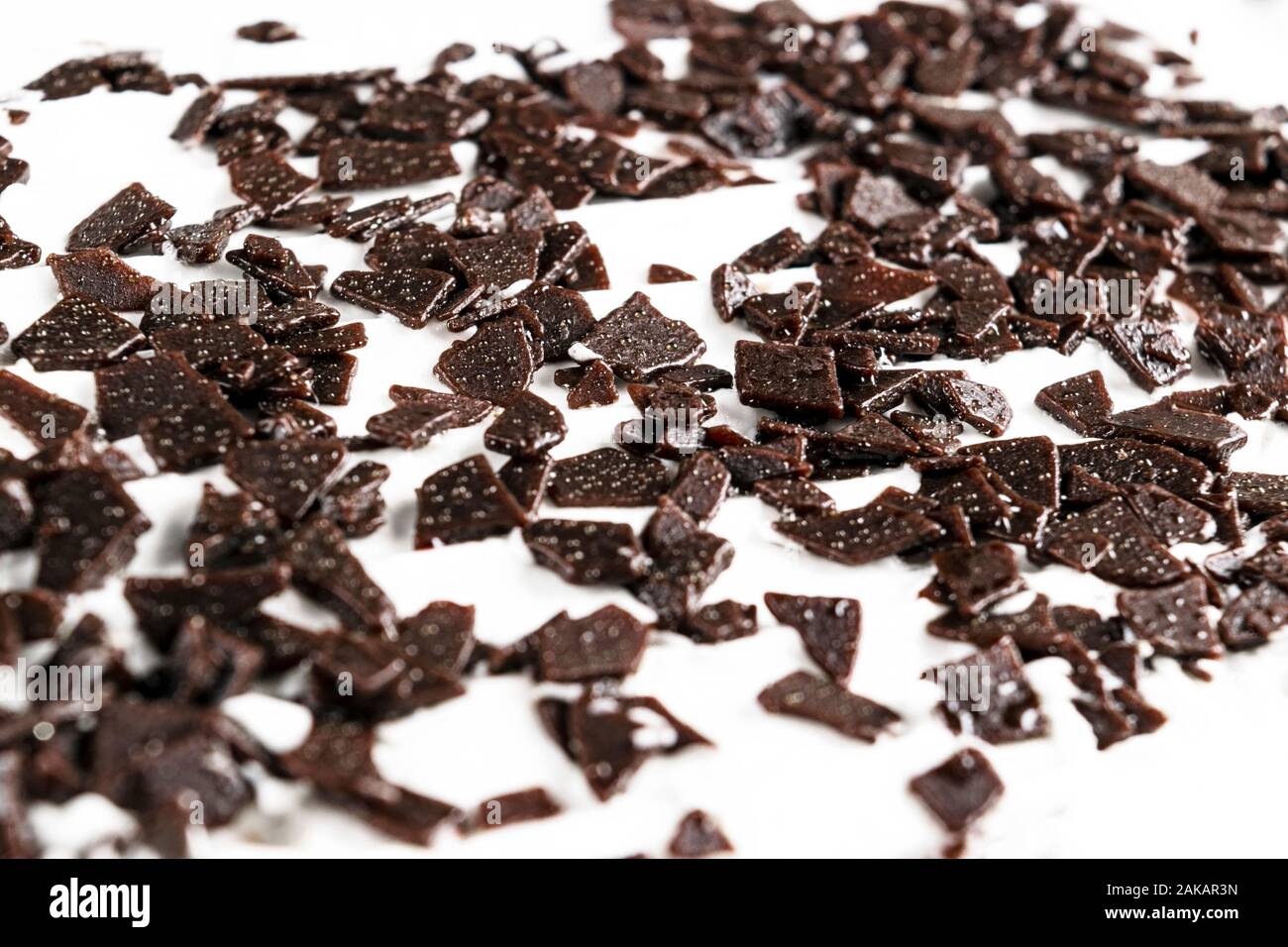 Grated chocolate. Pile of ground chocolate isolated on white background