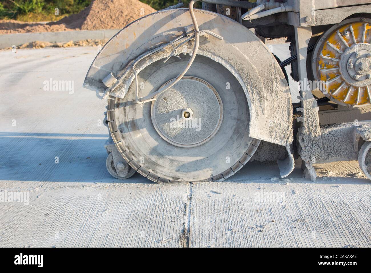 The joint cutter machine on a brushed concrete surface. Construction