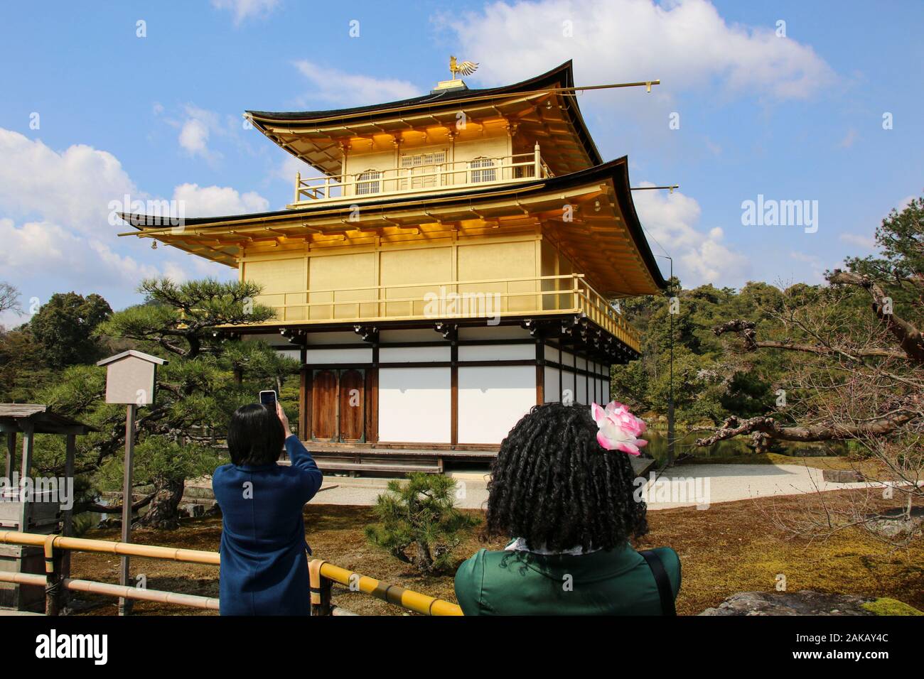 Tourists take a photo famous Kinkakuji Temple (The Golden Pavilion) in Kyoto, Japan Stock Photo