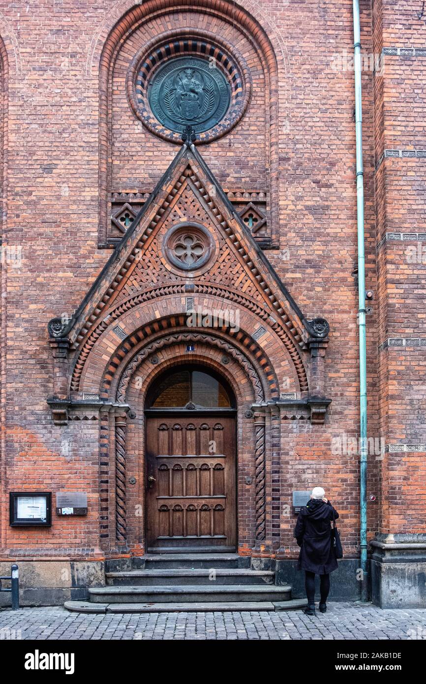 Denmark, Copenhagen University Library. Historic red brick building built 1857-1861 designed by Architect Johan Daniel Herholdt on Fiolstræde Stock Photo