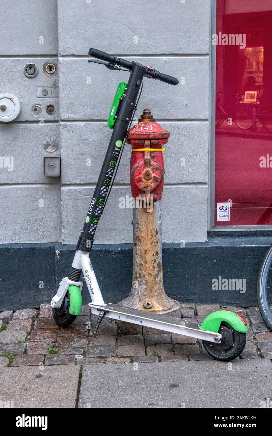 Old & New. Lime electric e-scooter parked next to old rusty fire hydrant in  Copenhagen Stock Photo - Alamy