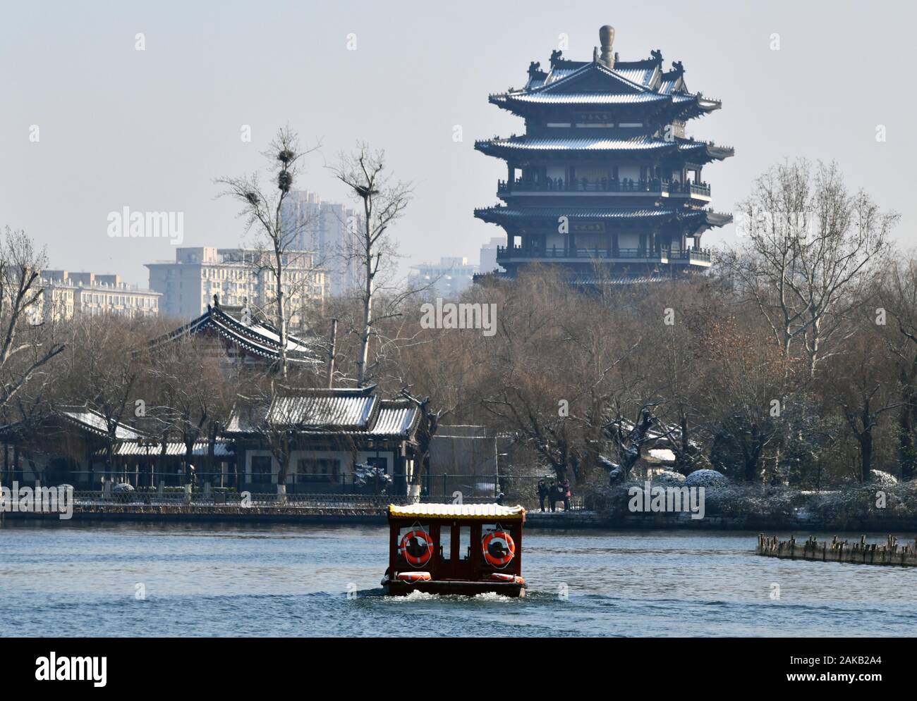 Jinan, China's Shandong Province. 8th Jan, 2020. Tourists cruise the Daming  Lake after snow in Jinan,