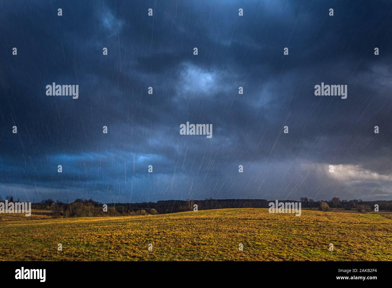 Stormy day with rain falling in the sky Stock Photo - Alamy