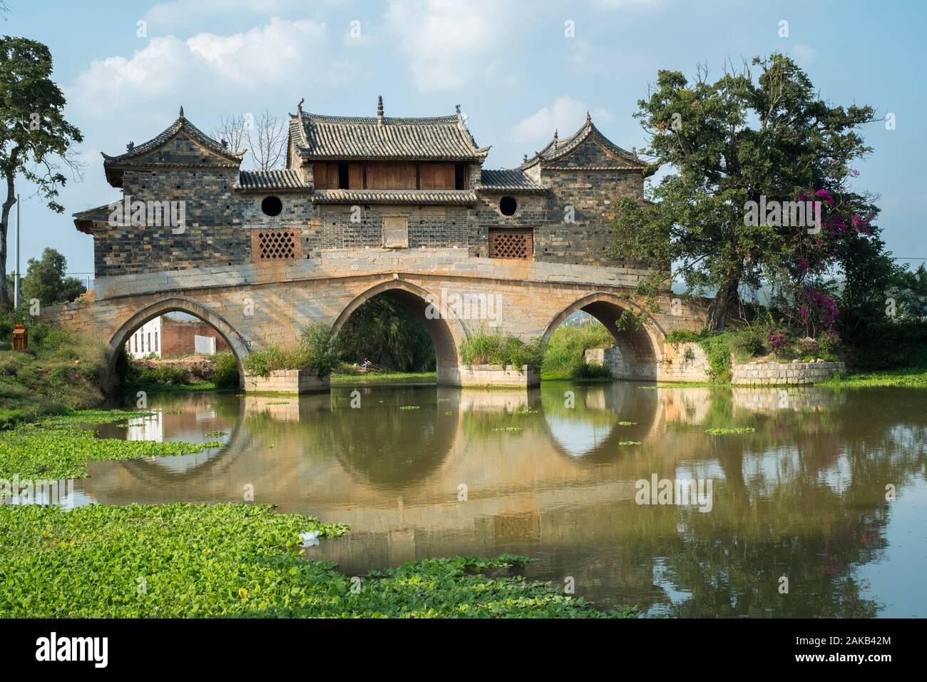 Xianghui Bridge was first built over the Lujiang River in Xinfang Village, Jianshui, Yunnan, China in 1814. Stock Photo