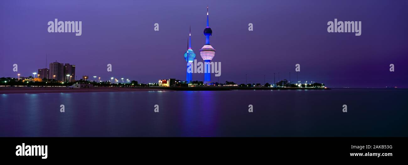 Cityscape with Kuwait Towers at night, Kuwait City, Kuwait Stock Photo