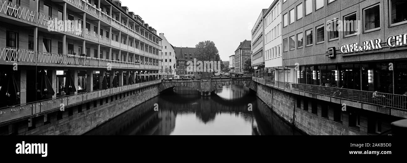 Black and white cityscape with canal and bridge in old town of Nuremberg, Bavaria, Germany Stock Photo