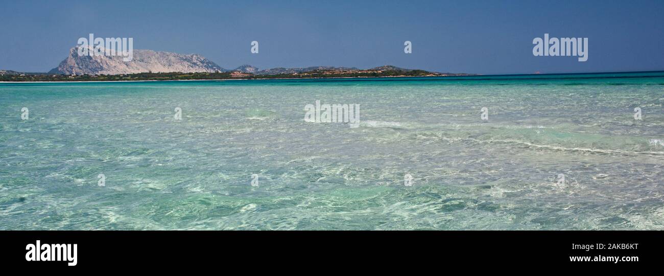 Seascape of Mediterranean sea at La Cinta Beach with Tavolara Island in background, San Teodoro, Sardinia, Italy Stock Photo