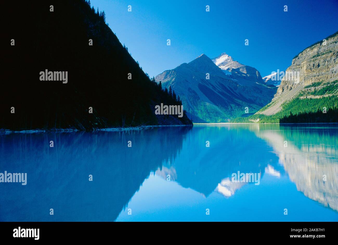 Landscape with view of mountains reflecting in Kinney Lake, Mount Robson Provincial Park, British Columbia, Canada Stock Photo