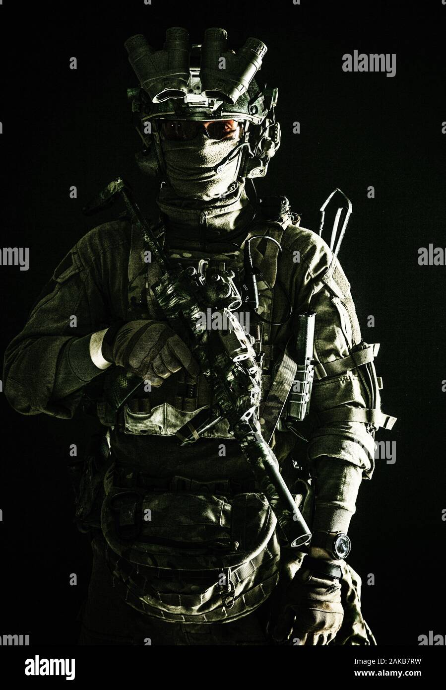 Army elite troops serviceman standing in darkness Stock Photo