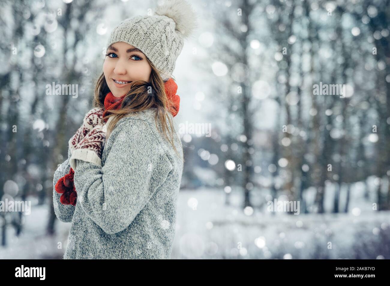Winter young woman portrait. Beauty Joyful Model Girl laughing and having fun in winter park. Beautiful young female outdoors, Enjoying nature Stock Photo