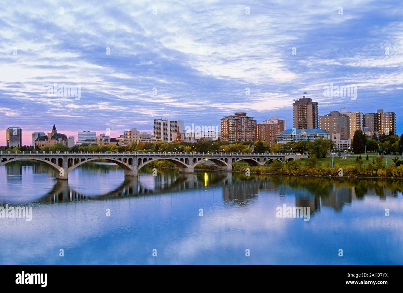 Cityscape with arch bridge over river, Saskatoon, Saskatchewan, Canada Stock Photo