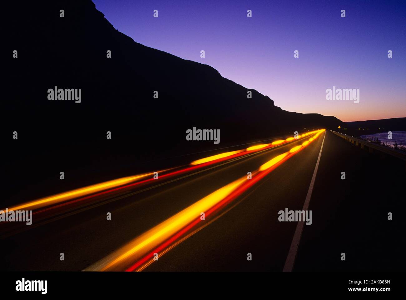 Light trails on road at night, Drumheller, Alberta, Canada Stock Photo