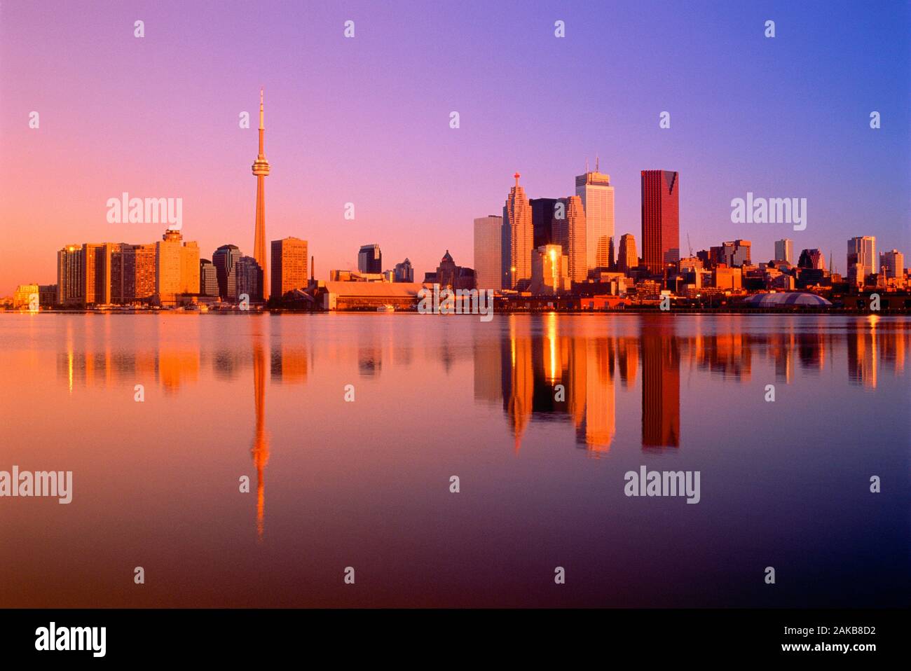 Cityscape with skyscrapers on waterfront at sunrise, Toronto, Ontario, Canada Stock Photo