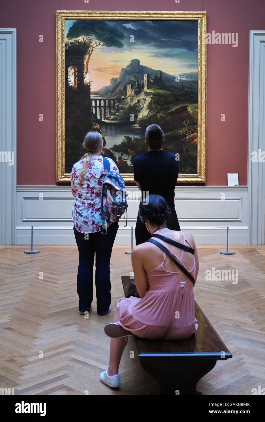 New York City, NY USA. Jul 2017. Focused painting being viewed by some museum visitors at The MET. Stock Photo