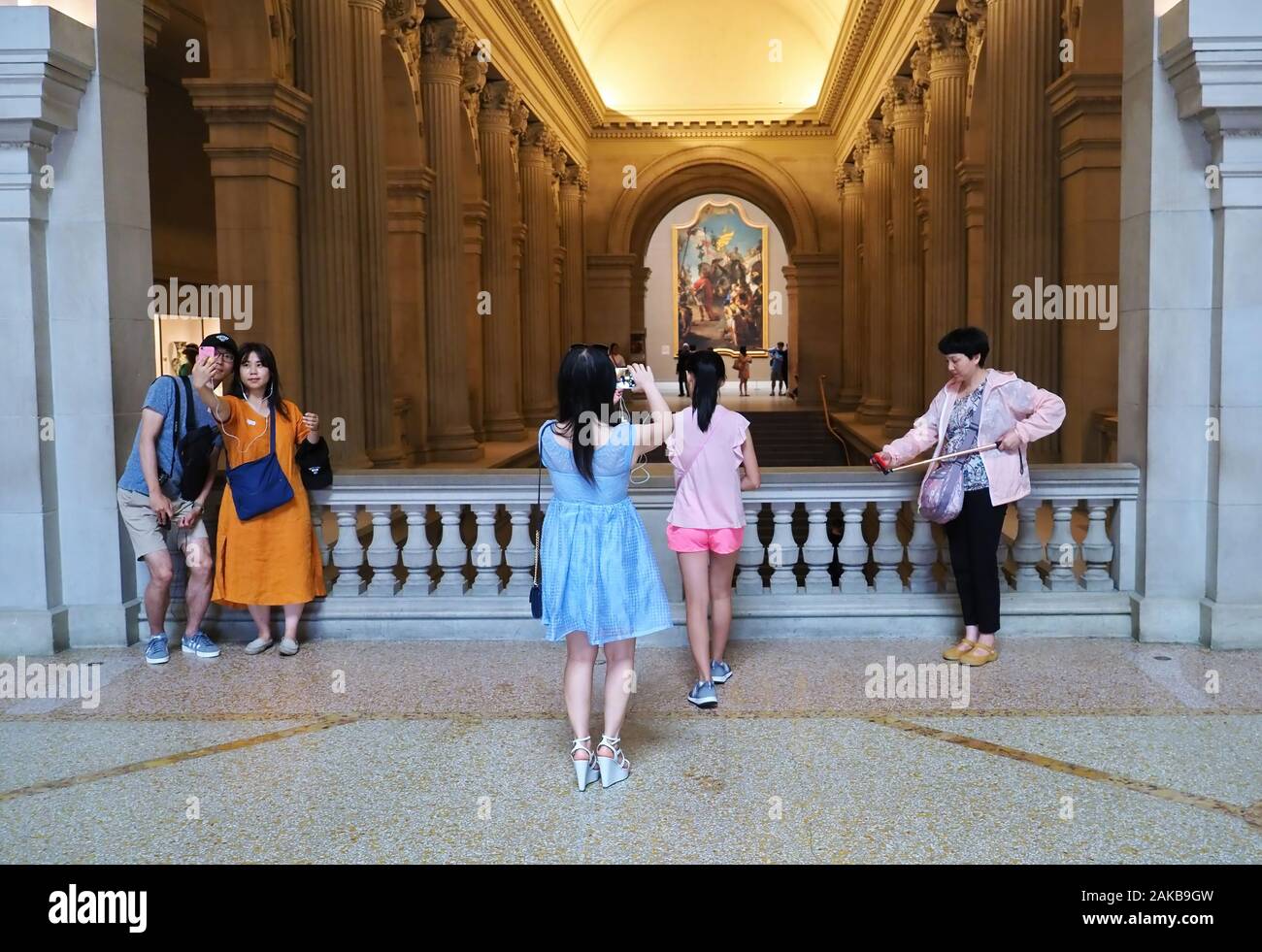 New York City, NY USA. Jul 2017. Asian mother instructing daughter for a camera pose as in the rest of the crowd. Stock Photo