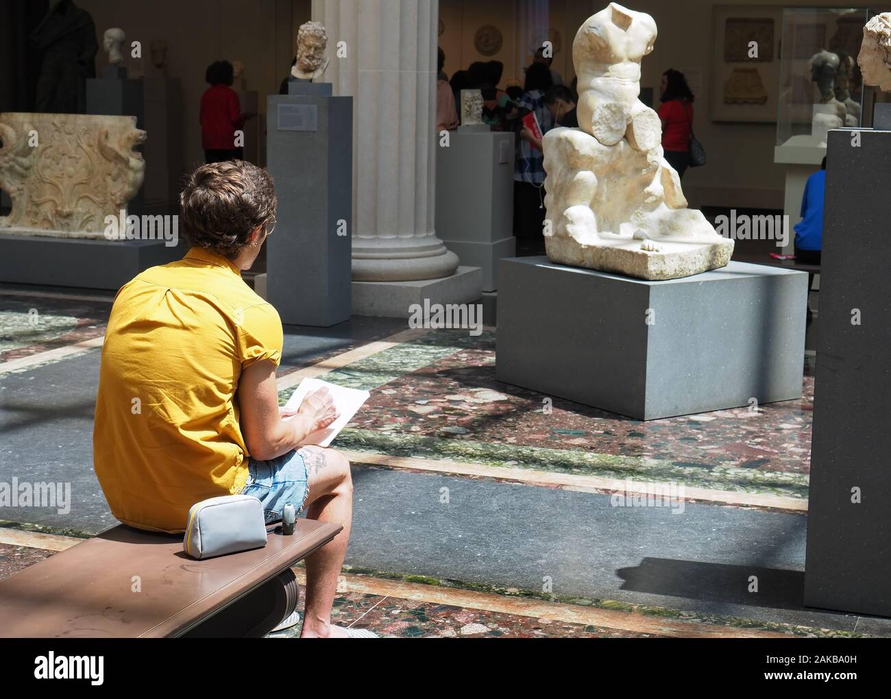 New York City, NY USA. Jul 2017. Visitors inside the Metropolitan Museum of Art enjoying the artwork and other forms of relaxation. Stock Photo