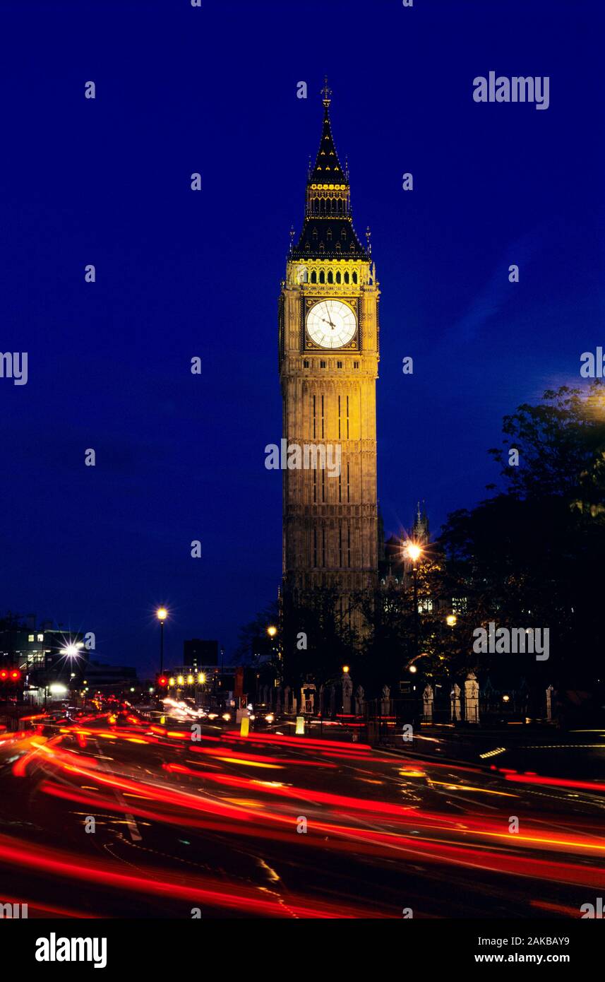 Big Ben and light trails on road at night, London, England, UK Stock Photo