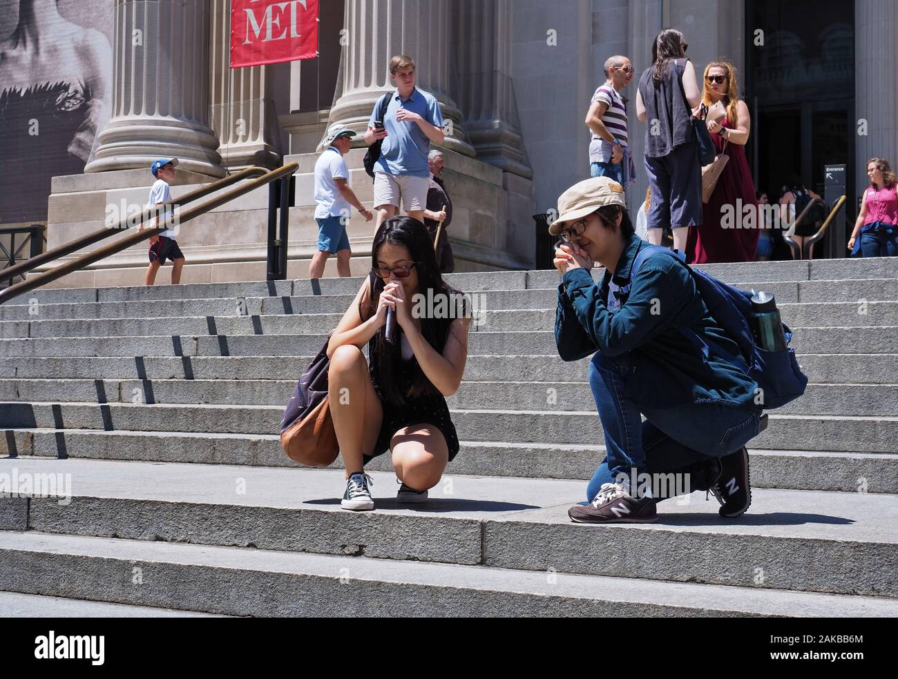 New York City, NY USA. Jul 2017. Asian teens funny posing for friends just outside the Metropolitan Museum of Art in New York City. Stock Photo