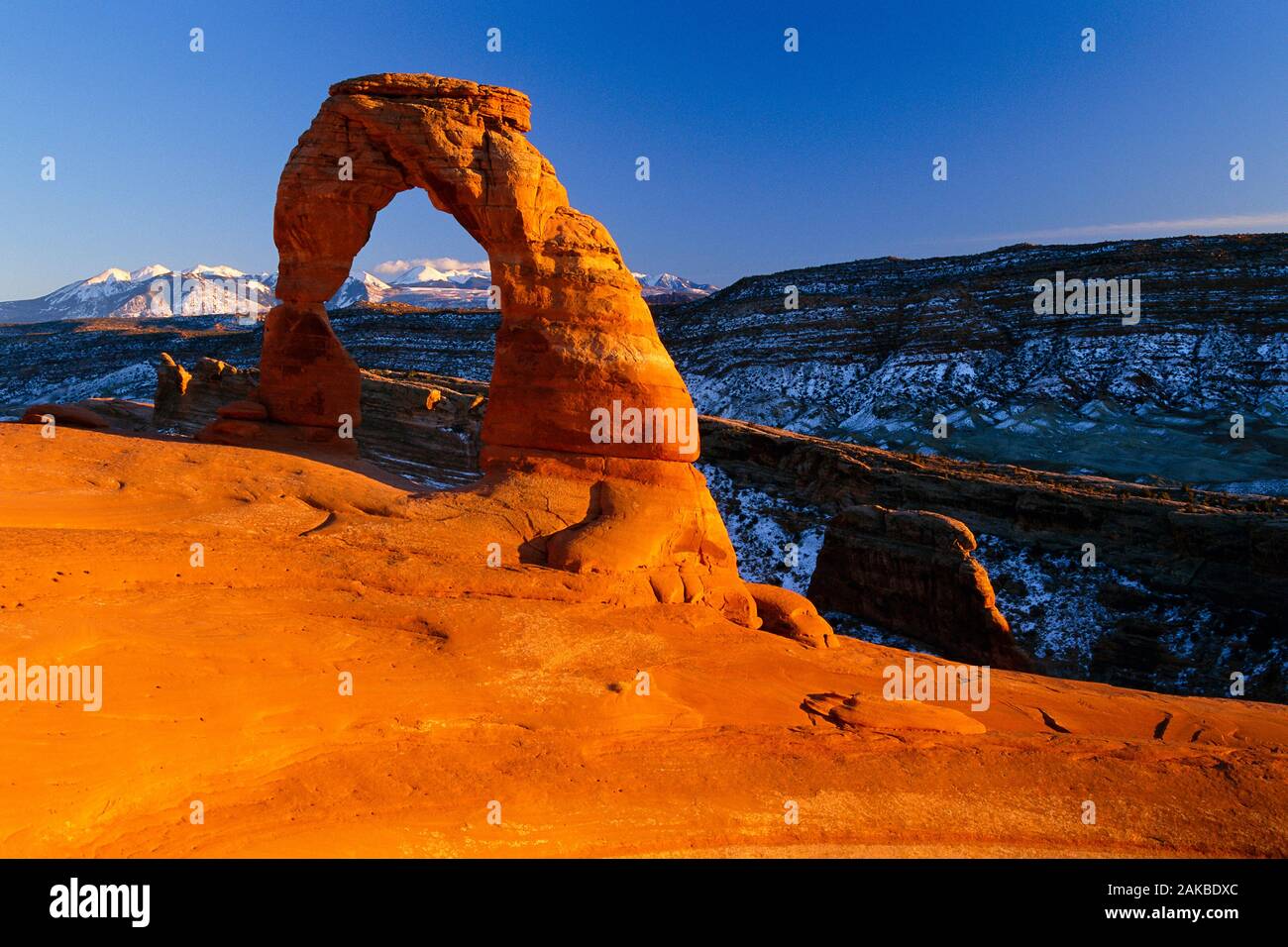 Landscape with natural sandstone arch in desert, Delicate Arch, Arches National Park, Utah, USA Stock Photo