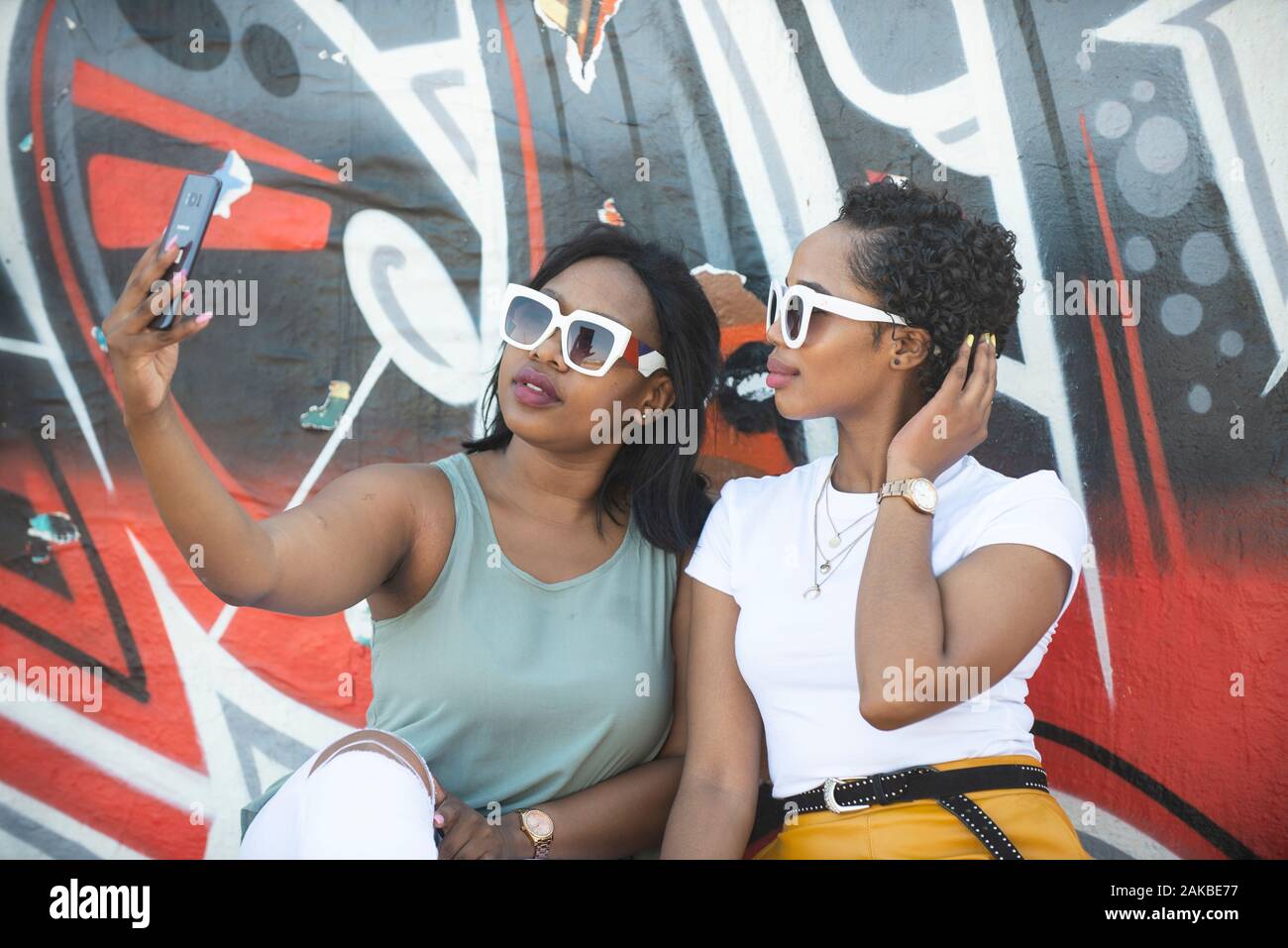 Two young women taking a selfie, Durban, South Africa Stock Photo Alamy