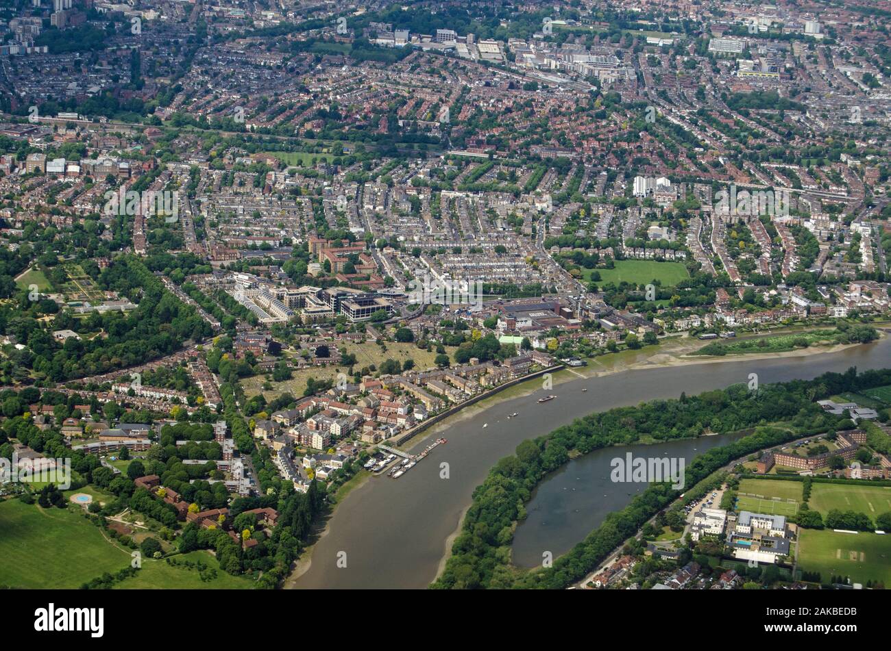 Aerial view of the River Thames as it flows between Chiswick and Barnes in West London on a sunny summer day.  The Leg O Mutton pond is to the bottom Stock Photo