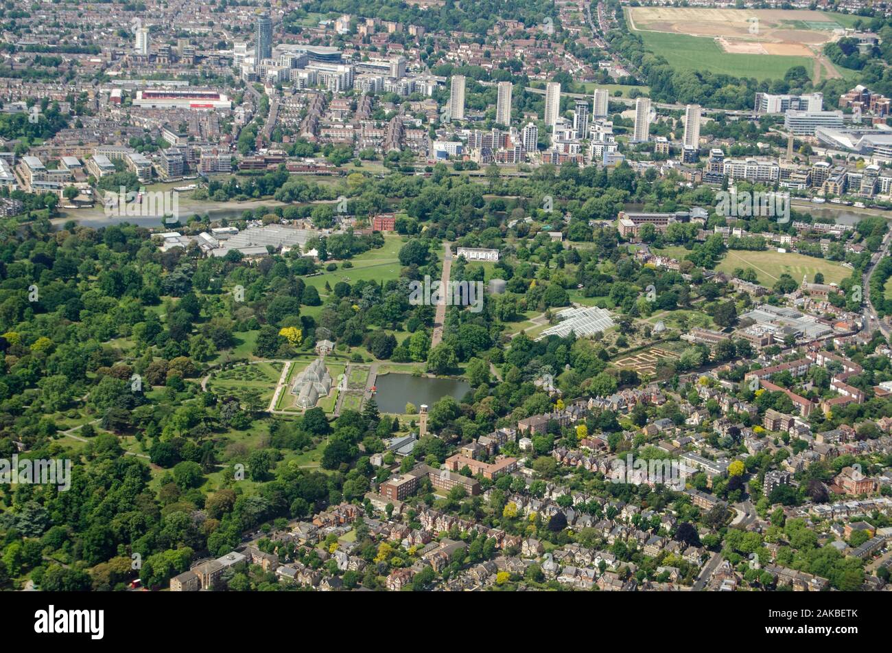 Aerial view of the historic Royal Botanic Gardens at Kew in West London on a sunny summer day.  The Palm House is in the middle of the image with Bren Stock Photo