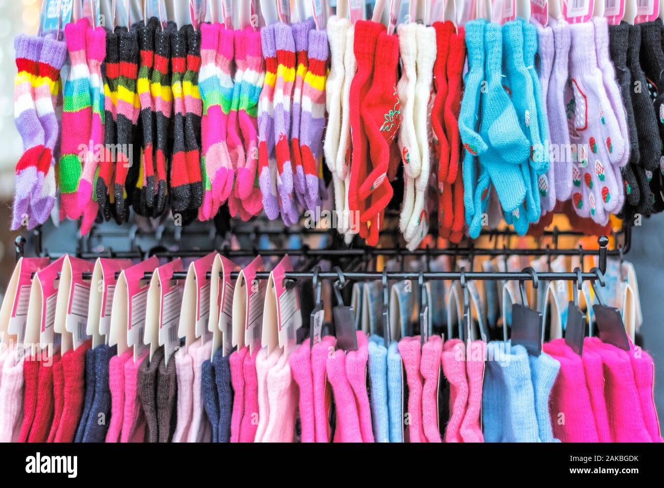 Rows of winter gloves on display at Christmas market in winter wonderland of London Stock Photo