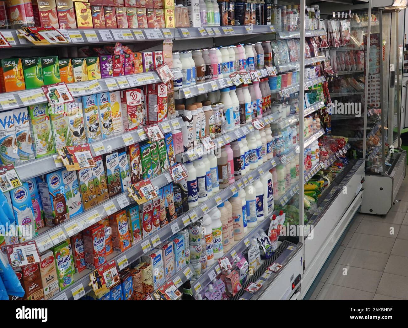 Pattaya, Thailand - December 24, 2019: Variety of milk, fruit and yoghurt drinks on shelf in FamilyMart  convenience store. Stock Photo