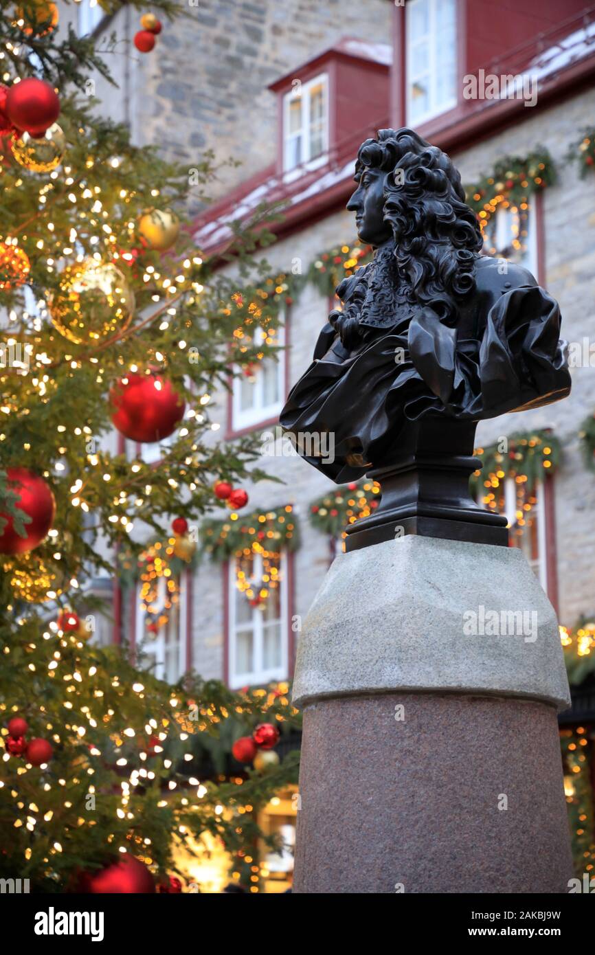 Statue of King Louis XIV with a Christmas tree at Place Royale.Quebec City.Quebec.Canada Stock Photo