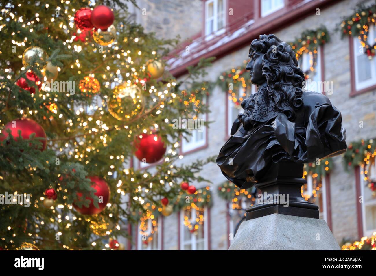 Statue of King Louis XIV with a Christmas tree at Place Royale.Quebec City.Quebec.Canada Stock Photo