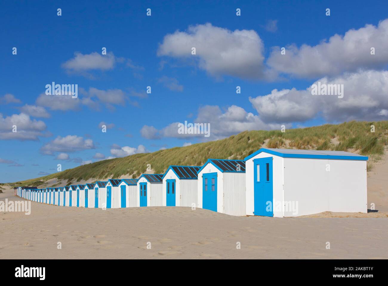 Row of blue and white beach cabins on Texel, West Frisian Island in the Wadden Sea, Noord-Holland, the Netherlands Stock Photo